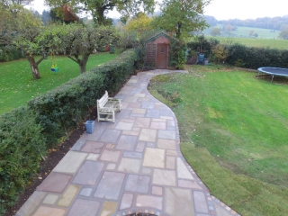 New Indian stone patio by Paul Gibbons Landscapes Ltd