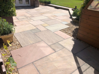 New patio in Indian stone by Paul Gibbons Landscapes Ltd